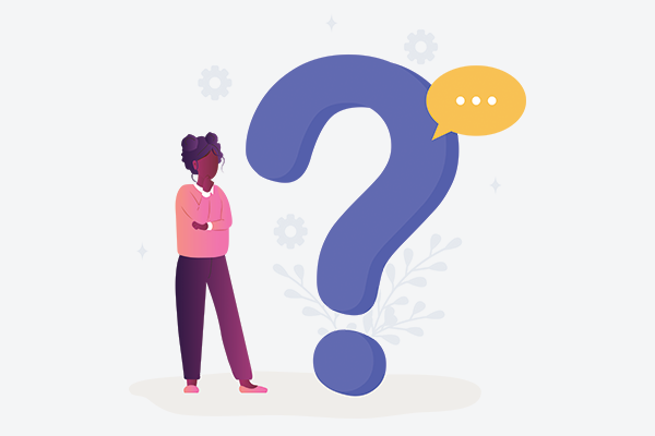 A person stainding beside a large question mark.